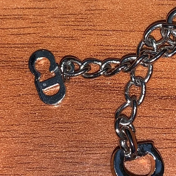 Authentic Christian Dior Leather and Metal Charm Bow Bracelet - Picture 4 of 11